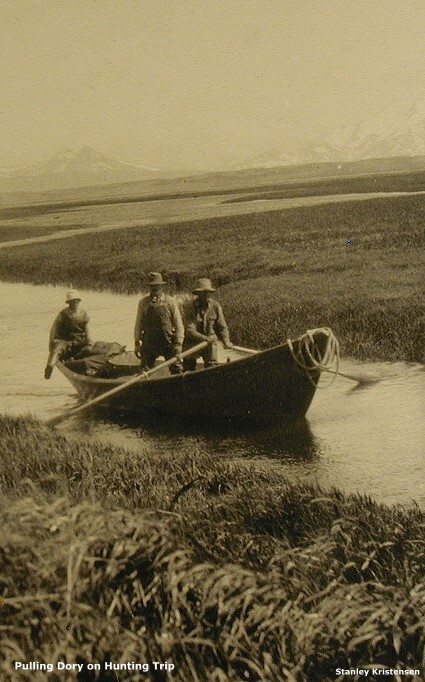 Pulling dory on hunting trip, ~1925